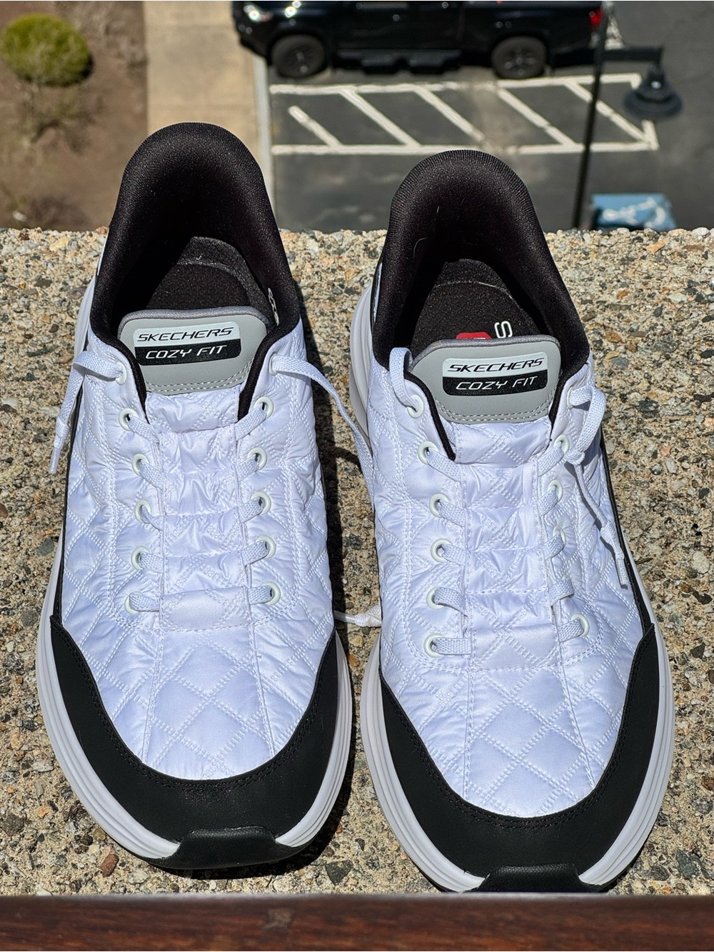 Skechers Men’s White Quilted Cozy Fit Slip-On Athletic Sneakers with Black Trim